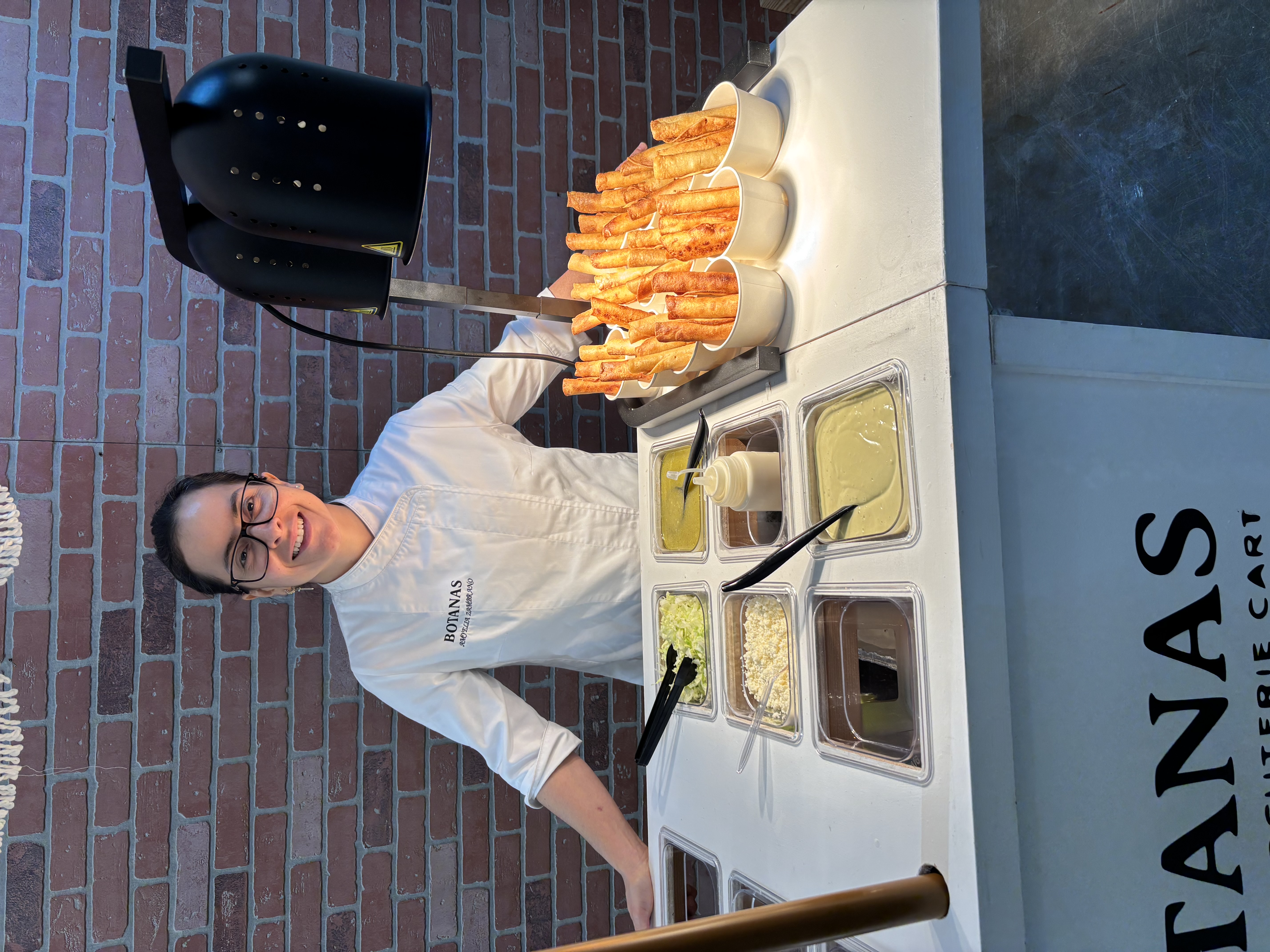 Botanas staffed flautas snack cart at a Houston event